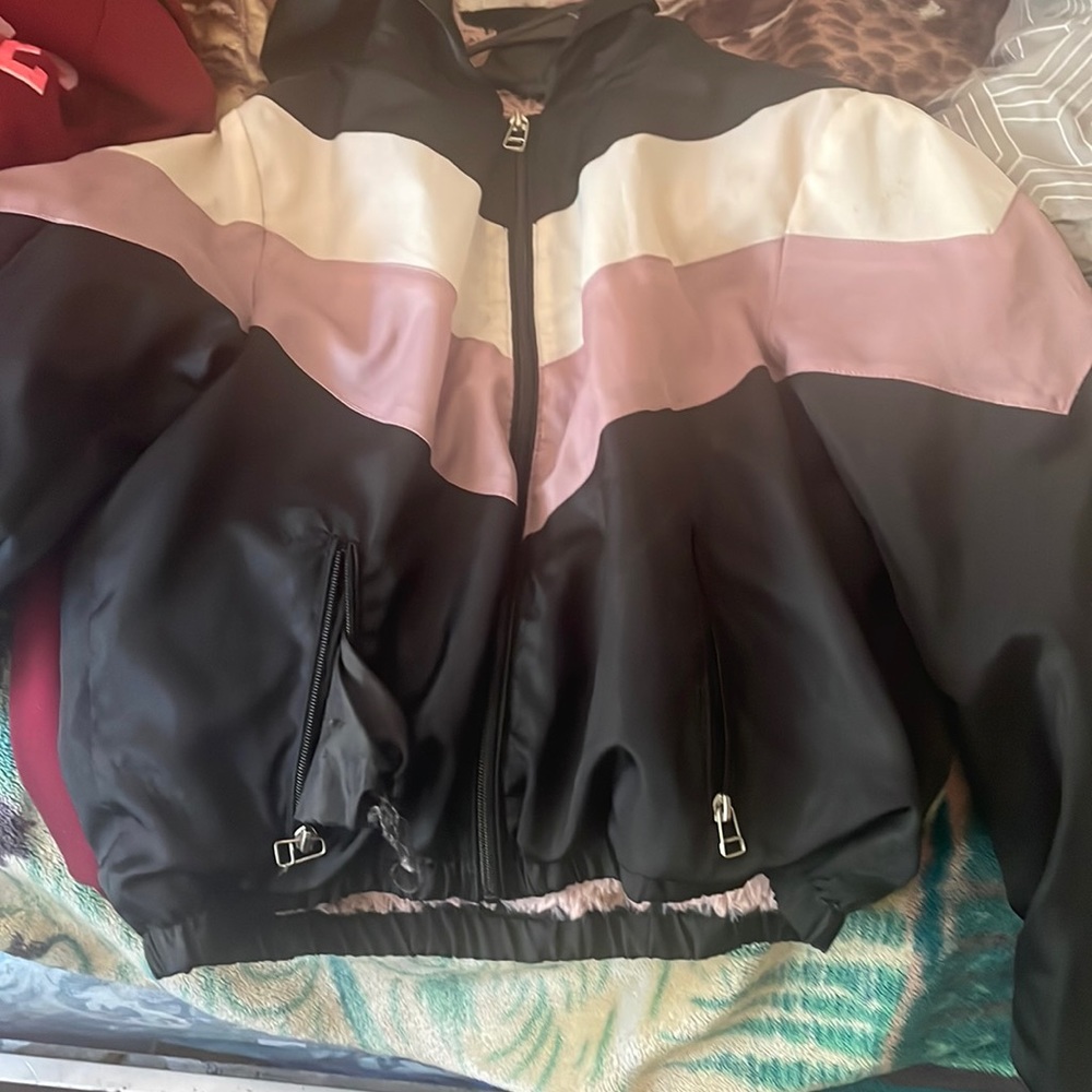 DELIA*s girls jacket, the colors are white, pink nd black wit pink fur